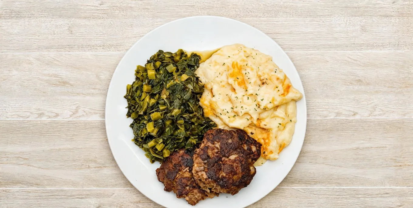 Meatloaf plate with collard greens and mashed potatoes